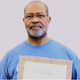 Ron Stallworth holding KKK membership plaque
Ron Stallworth/Blackklansman.com